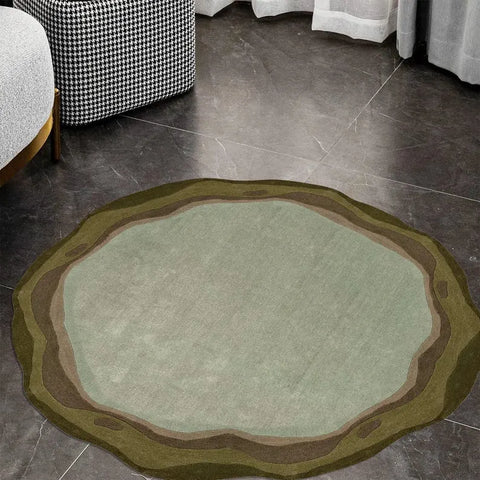 irregular round shaped sage green hand tufted rug