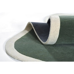 Cream and sage green solid hand tufted rug