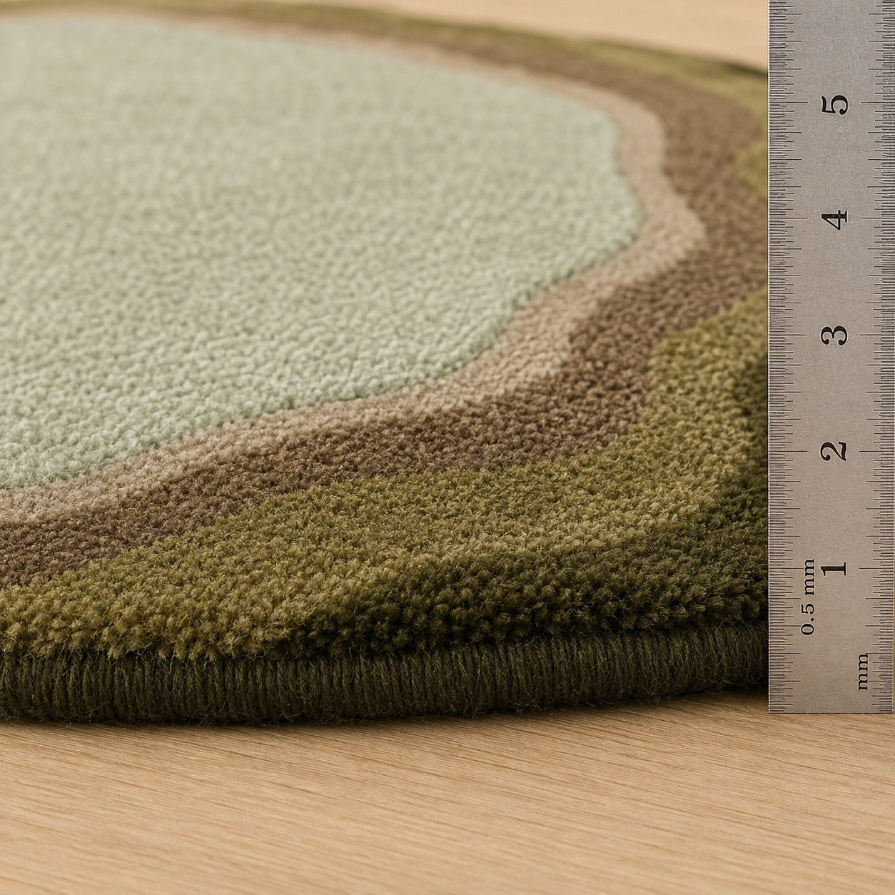 Sage green earthy round wool rug