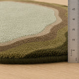 Sage green earthy round wool rug