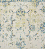 Shabby chic handwoven rug with faded floral patterns in blue, beige, and cream tones