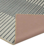 Luxury Mannat Rugs handwoven silver gray ombre rug with modern black stripe pattern and beige backing