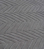 Luxury wool rug in slate grey with subtle textured detailing