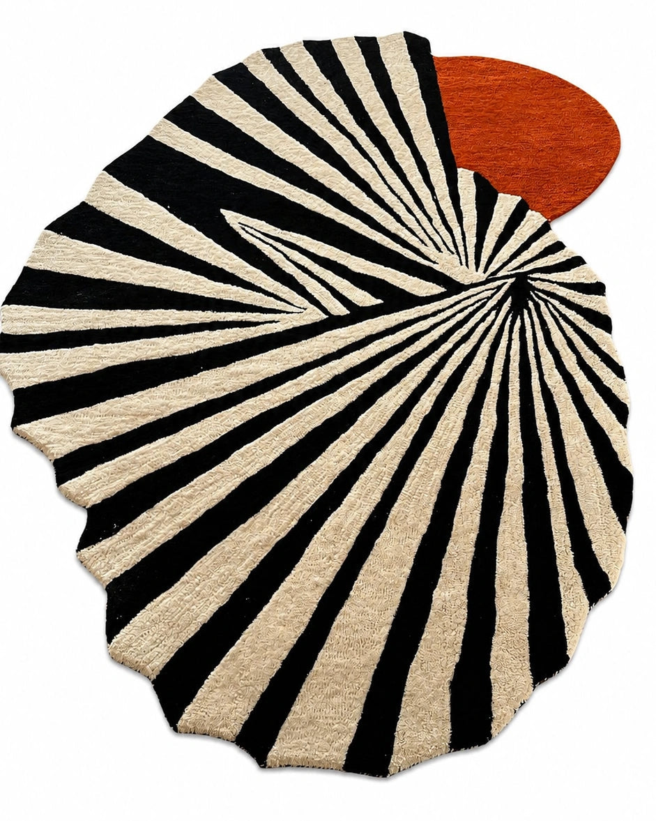 Round rug with black and white striped pattern and a red circular design on a white background