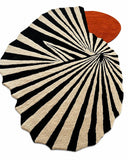 Round rug with black and white striped pattern and a red circular design on a white background