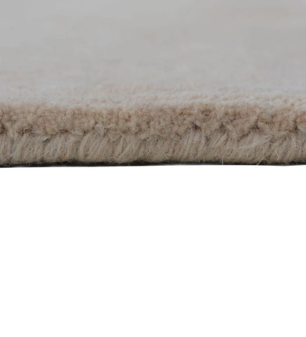 Neutral hand-tufted wool rug for minimalist living rooms
