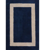 Solid midnight blue rug with a minimalist beige rectangular border design