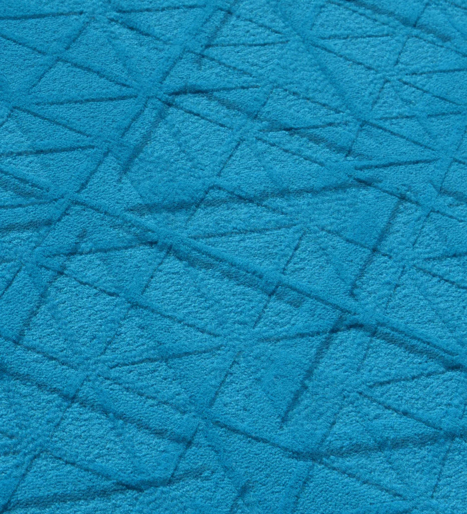 Contemporary blue wool rug with embossed triangular details
