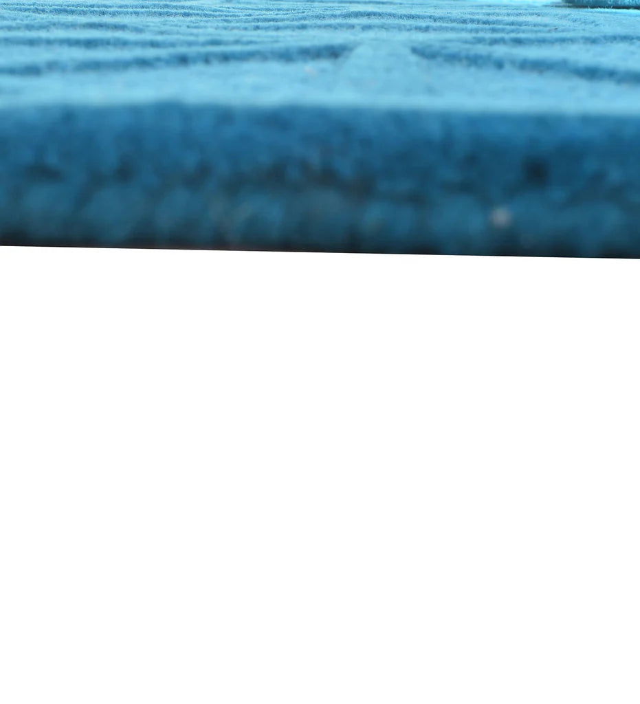 Embossed geometric blue wool rug for modern interiors