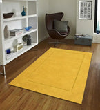 Minimalist gold wool rug with subtle rectangle design