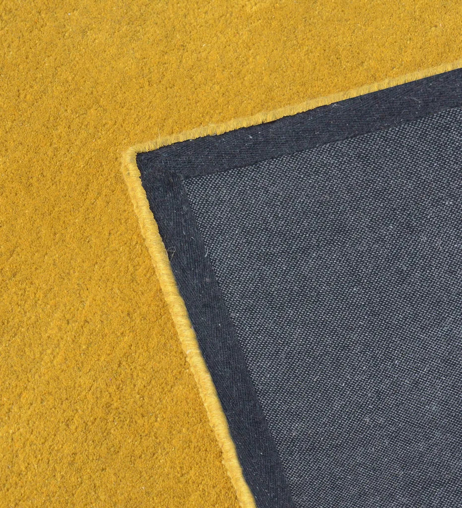 Handcrafted golden yellow wool rug with minimalist border