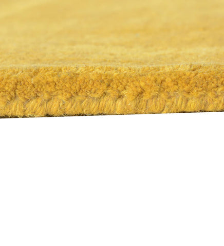 Solid gold hand-tufted rug for living room or bedroom decor