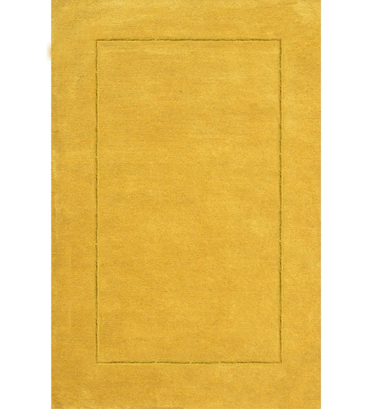 Solid golden yellow hand-tufted wool rug with embossed border