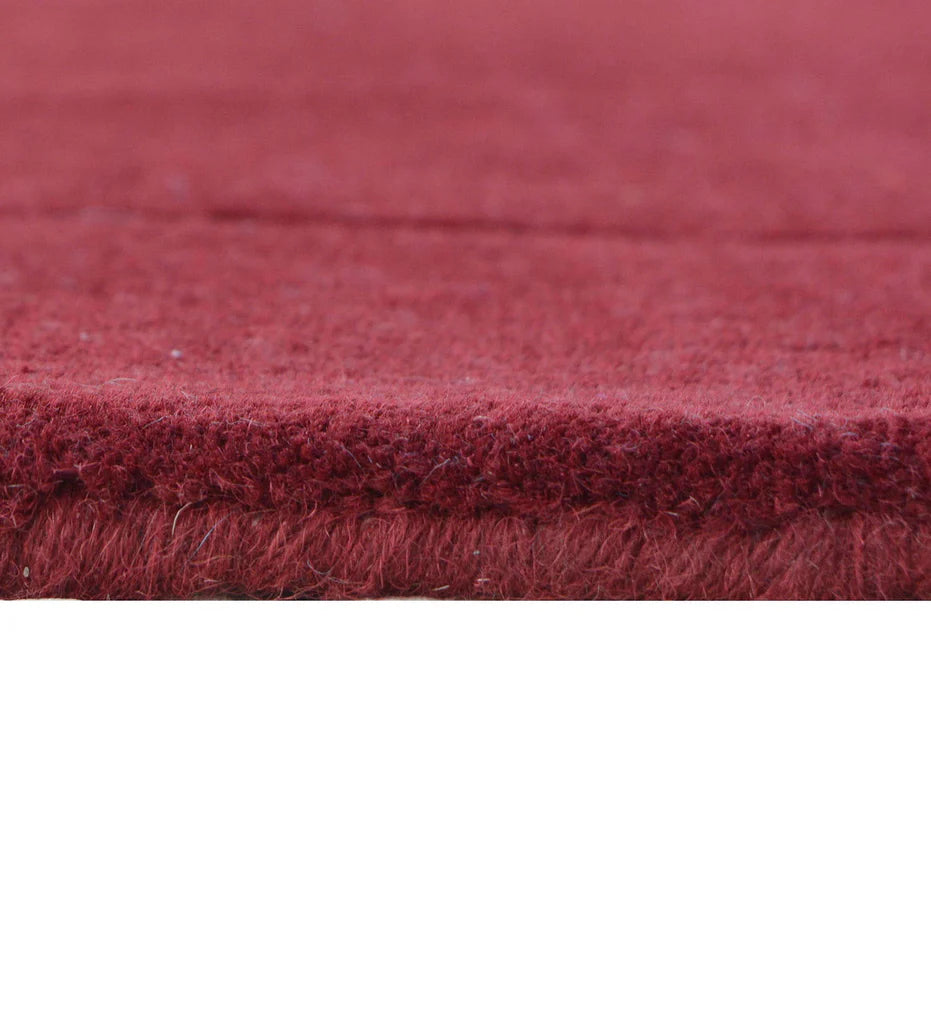 Handcrafted solid maroon rug for contemporary interiors