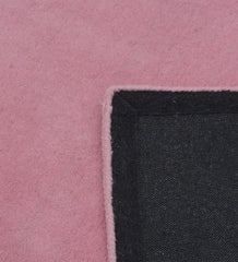 Handcrafted pink wool rug with modern minimalist style