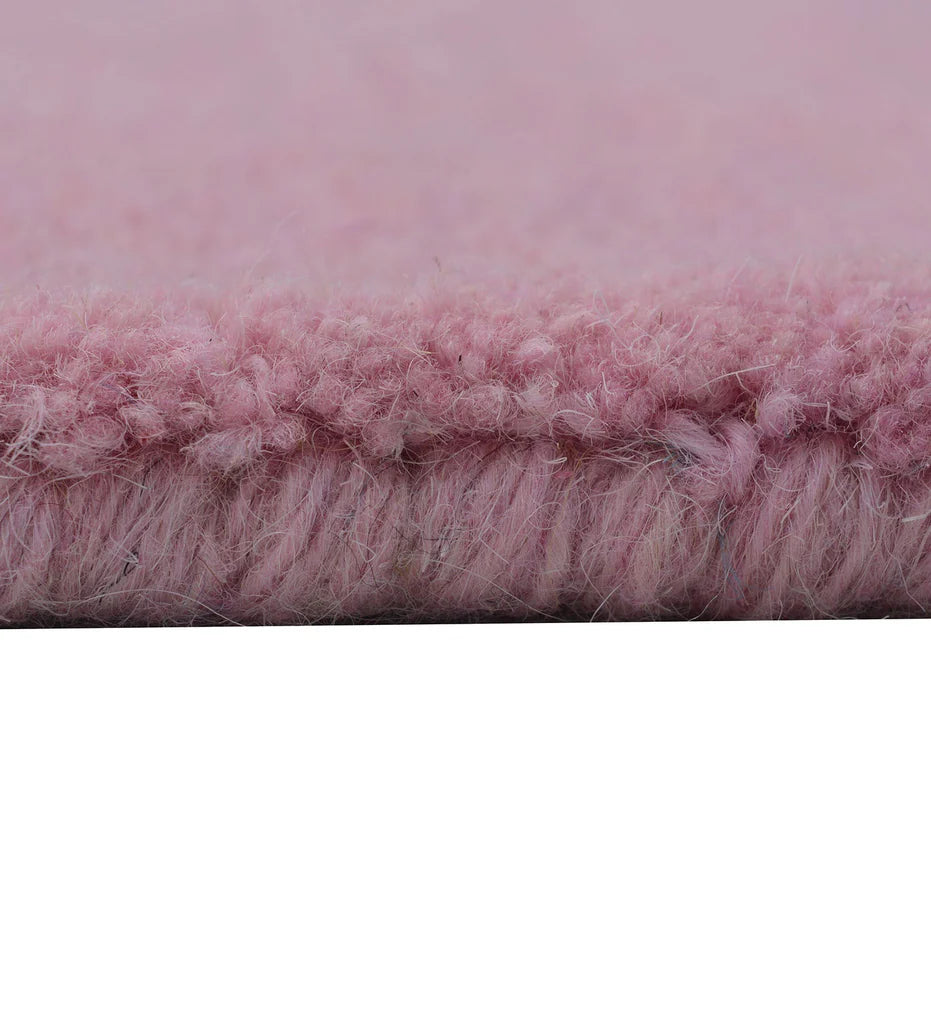 Soft pink hand-tufted rug for nursery or bedroom decor