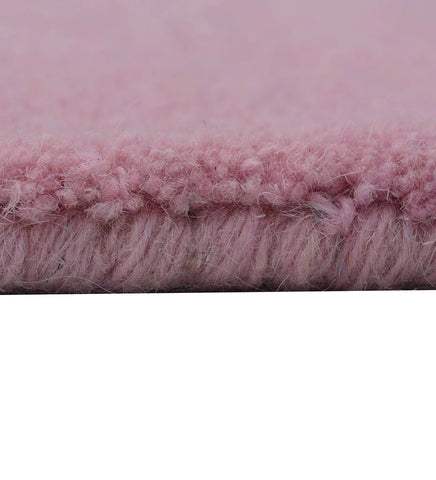 Soft pink hand-tufted rug for nursery or bedroom decor