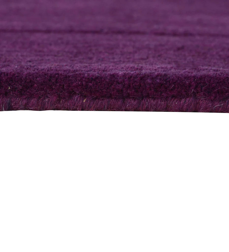 Modern solid plum rug with embossed rectangle detailing