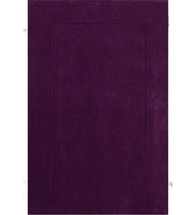 Solid purple hand-tufted wool rug with embossed rectangle