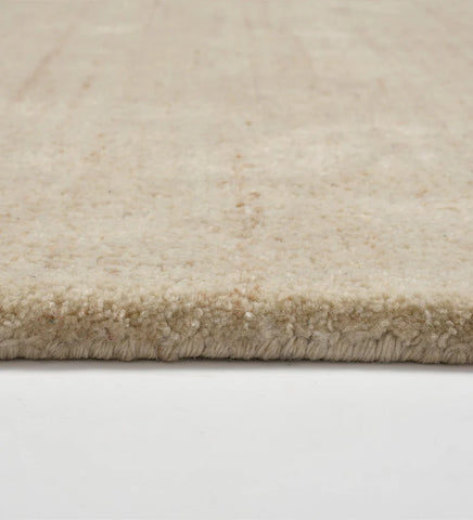 Solid neutral beige hand-tufted rug for living rooms