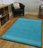Modern teal rug featuring subtle linear texture pattern
