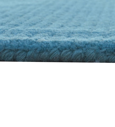 Premium teal hand-tufted wool rug with textured design