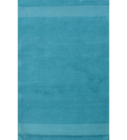 Solid teal hand-tufted wool rug with minimalist linear design