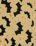 Beige and black Halloween rug pattern with flying bats and orange speckles