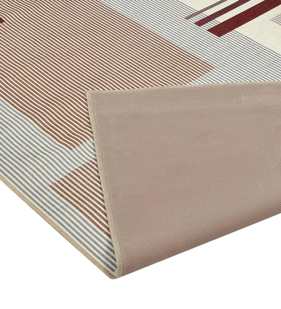 Machine washable rug with modern geometric design.
