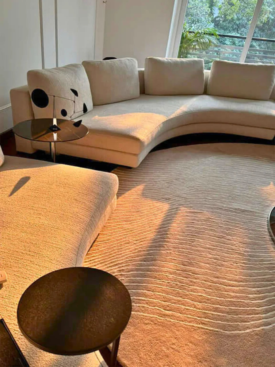 Soft wool rug handcrafted in taupe and white for minimalist interiors.