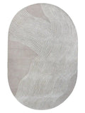 Taupe and white hand-tufted oval wool rug with modern wavy line design.
