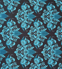 Teal damask design area rug.