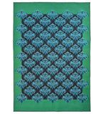 Teal damask style handwoven rug with intricate blue floral patterns on a black background and green border