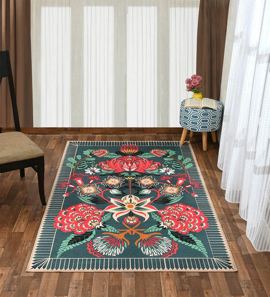 Machine washable teal area rug with floral design.