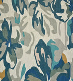 Handwoven luxury rug with teal and blue floral watercolor design, soft cream background