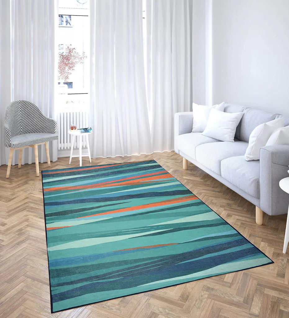 Machine washable area rug with teal, coral, and neutral tones.
