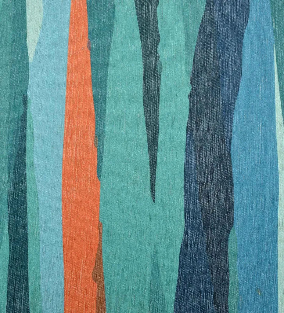 Modern abstract patterned rug in teal and coral.
