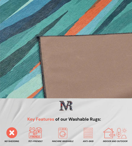 Washable modern rug with bold teal and coral design.
