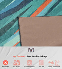 Washable modern rug with bold teal and coral design.