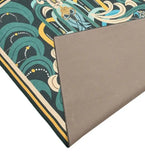 Teal and gold luxury handwoven rug with abstract floral pattern, folded to show solid backing