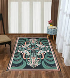 Teal and peach abstract patterned luxury handwoven rug on wooden floor with patterned stool and flower vase