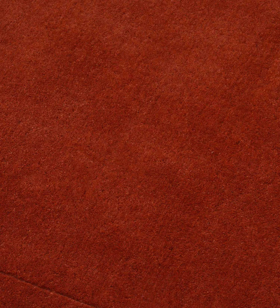 Luxury solid terracotta orange rug for modern interiors