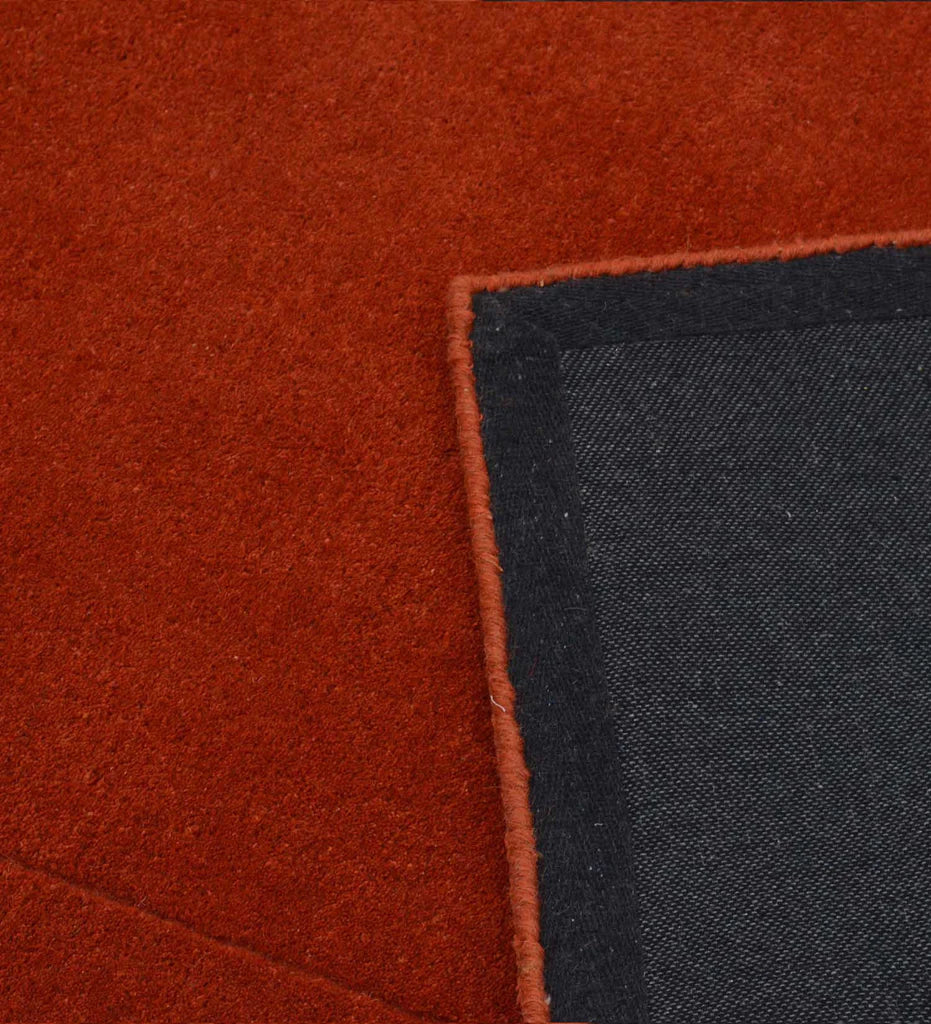 Handcrafted wool rug in terracotta orange minimalist style