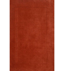 Solid terracotta orange hand-tufted wool rug with embossed rectangle