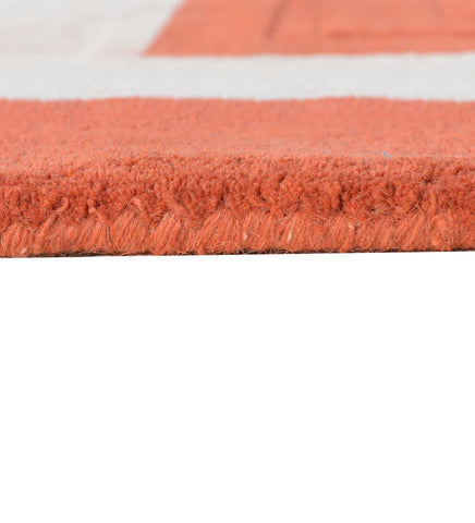 Terracotta orange bordered rug with beige frame modern style