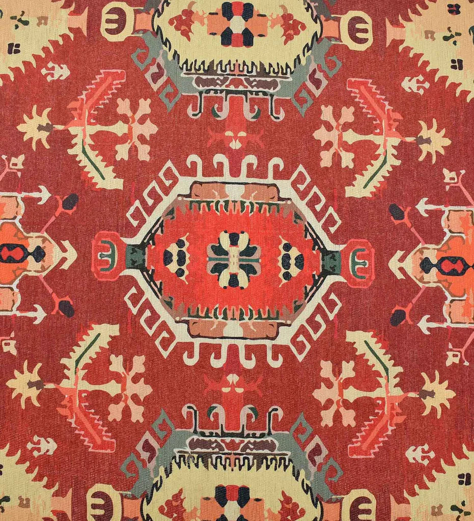 Low-profile terracotta rug with cream and gold accents.