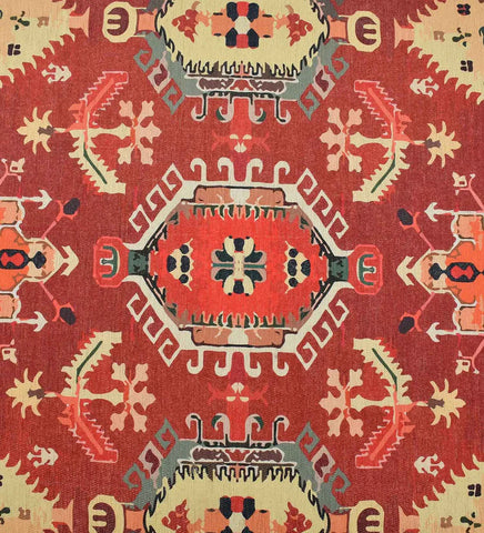 Low-profile terracotta rug with cream and gold accents.