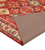 Terracotta red traditional handwoven rug with geometric and floral motifs and beige border detail