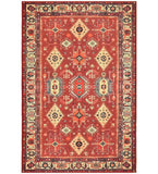 Terracotta red traditional handwoven rug with intricate geometric and floral patterns, decorative cream border