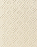 Minimalist cream hand-tufted rug featuring 3D diamond relief design.